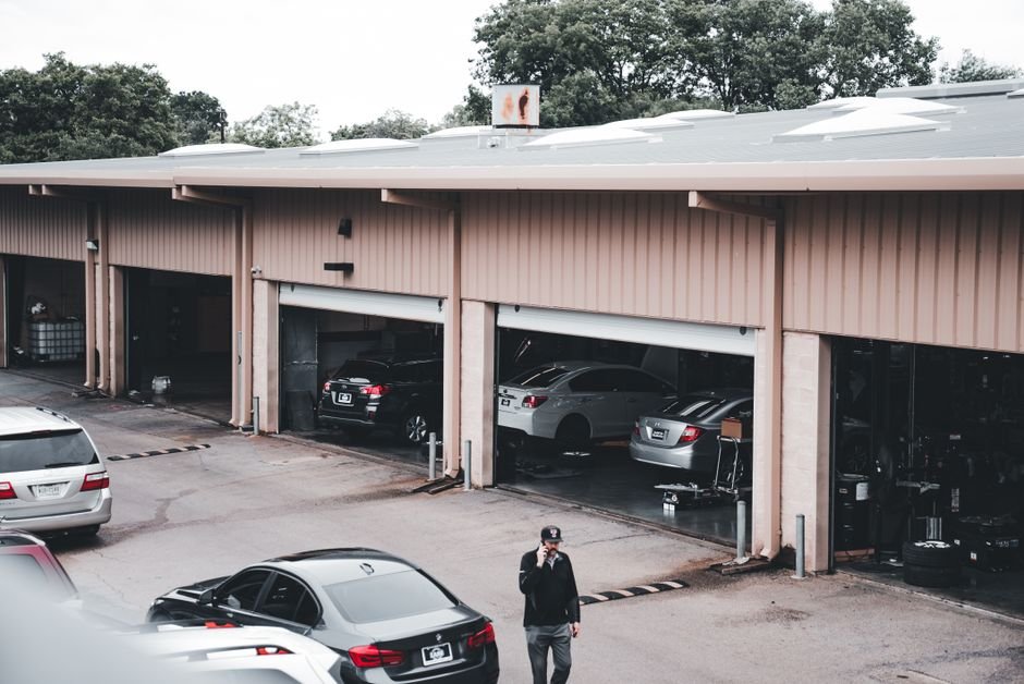 Mobile tyre fitter working on a driveway
