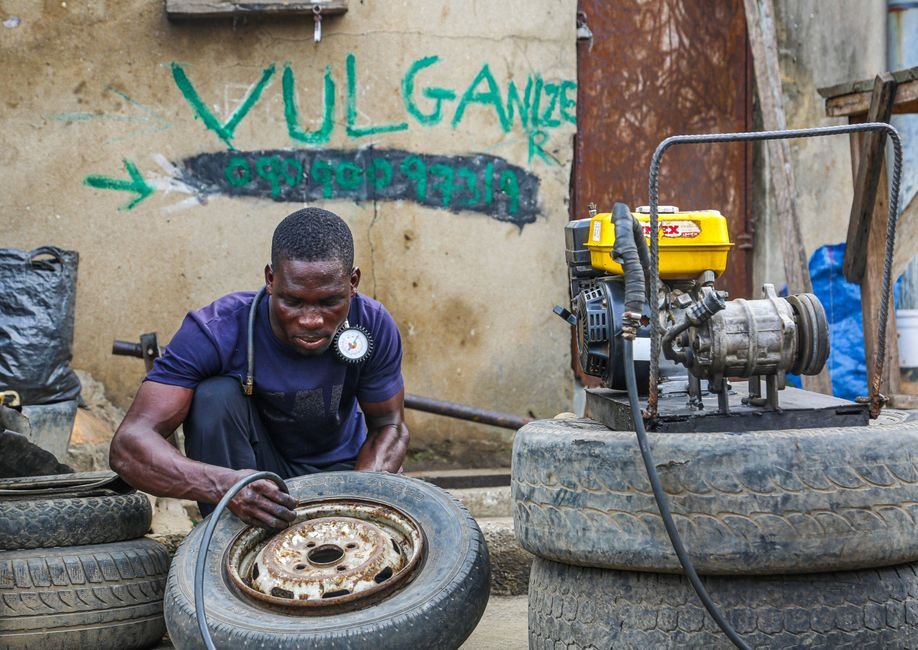 Mechanic repairing a punctured tyre